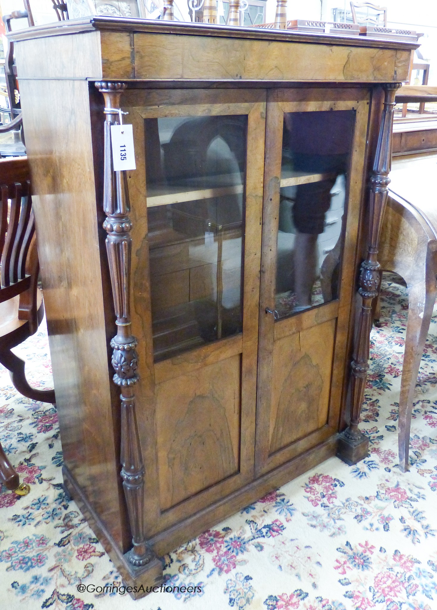 A small mid 19th century French rosewood two door cabinet (faded)